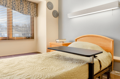 Cozy resident room with a bed and natural light
