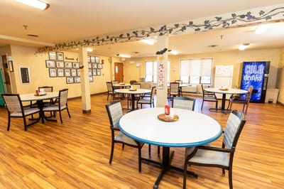 Bright dining area with tables and chairs