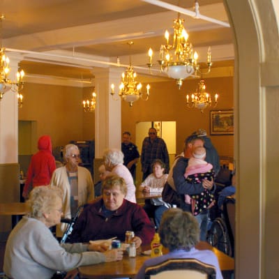 Residents and family interacting in a social area