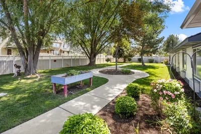 Well-maintained garden path with flower beds