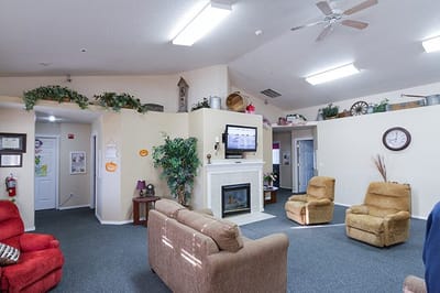 Common area with seating and fireplace