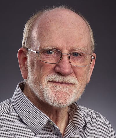 Portrait of a senior man with glasses smiling