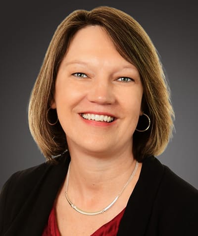 Portrait of a smiling woman with shoulder-length hair