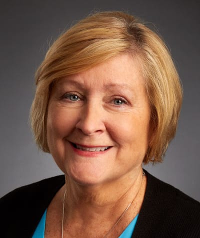 Portrait of a smiling woman in a professional setting