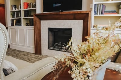 Cozy interior of a common area with a fireplace