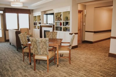Interior view of a common area with seating and shelves