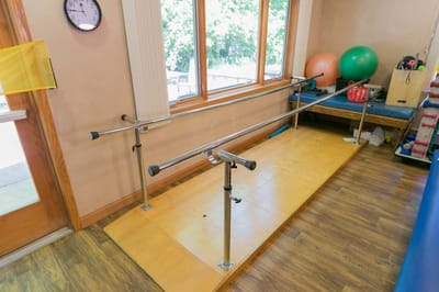 Rehabilitation equipment in a bright activity room