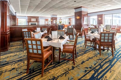 Dining room arrangement with tables and chairs