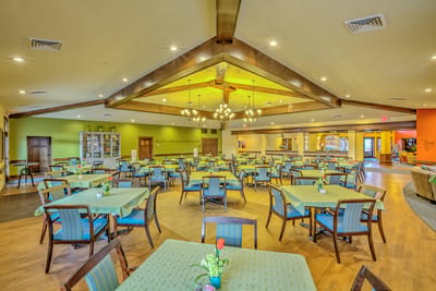 Bright dining area with tables and chairs