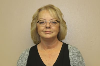Portrait of a staff member in front of a plain background