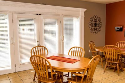 Dining area with wooden tables and chairs