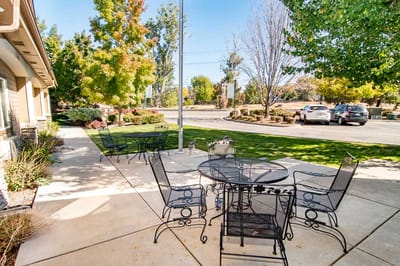 Outdoor seating area with tables and chairs