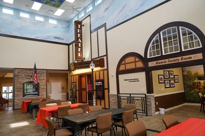 Interior view of a common area with tables and decor