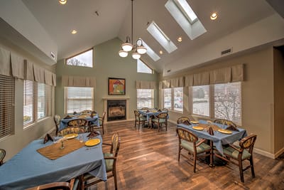Bright dining room with large windows and tables