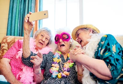 Residents celebrating with masks and decorations