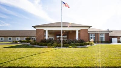 Exterior view of Cedarhurst of Highland with flagpole