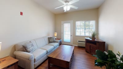Cozy common area with a sofa and TV