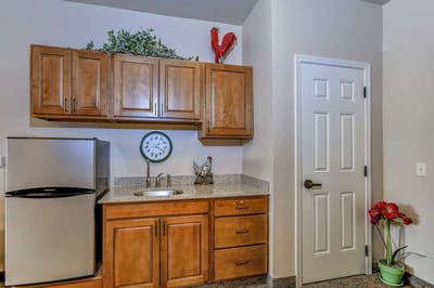 Interior kitchen area with cabinets and appliances