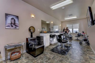 Hair salon area with a resident getting their hair done