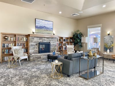 Cozy common area with a fireplace and bookshelves