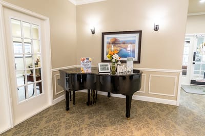 A grand piano in a welcoming lobby area