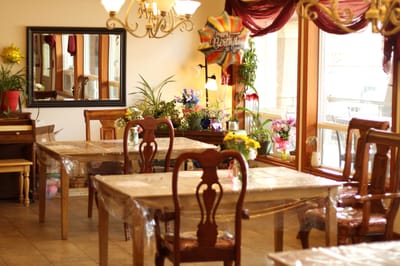 Common area with decorated tables and plants
