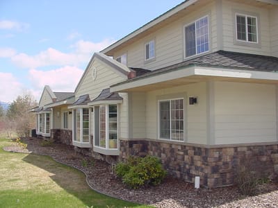 Exterior view of Hearthstone Village with landscaped garden