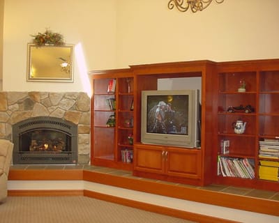 Cozy common area with a fireplace and a TV