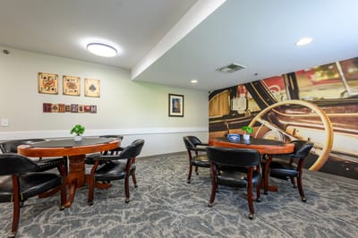 Common area with seating and decorative wall
