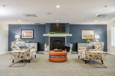 Cozy common area with seating and a fireplace