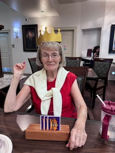 Resident playing a game with a crown on