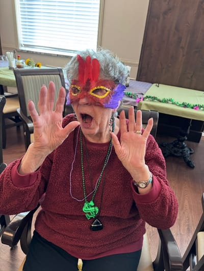 Resident enjoying a festive activity with decorations