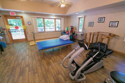 Rehabilitation room with therapy equipment and exercise area