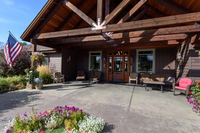 Entrance of Wellspring Meadows Assisted Living with flowers