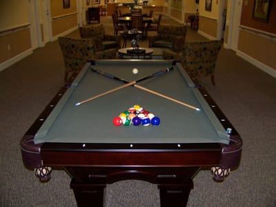 Pool table in a common area with lounge seating
