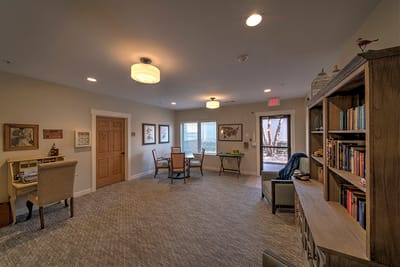 Bright common area with seating and bookshelves