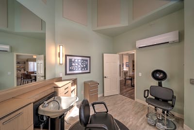 Interior view of a salon area with styling chairs