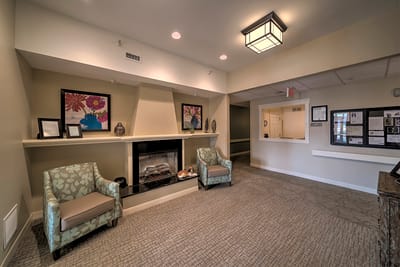 A cozy interior lobby with chairs and decor
