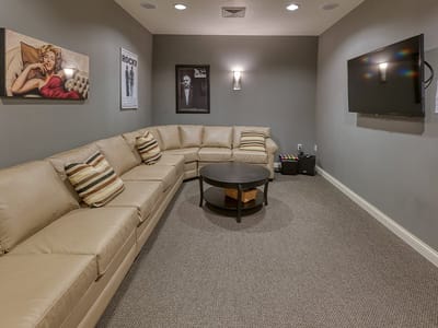 Cozy lounge area with seating and artwork
