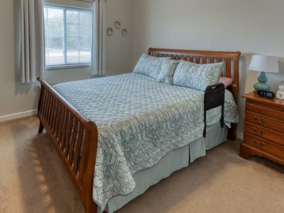 Cozy bedroom with a bed and nightstand