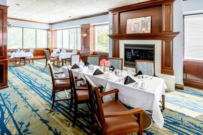 Elegant dining room setting with tables and flowers