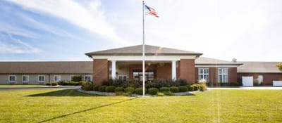 Exterior view of Cedarhurst of Highland with landscaped garden