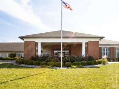 Front entrance of Cedarhurst of Highland with landscaped garden