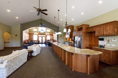 Interior view of a common area with kitchen and seating