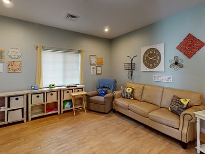 Common area with seating and decorative wall art