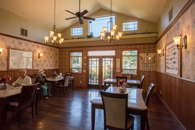 Interior dining room with residents seated at tables