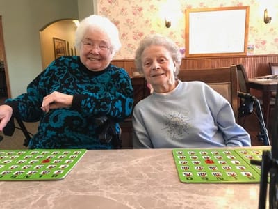 Residents playing bingo in a common area