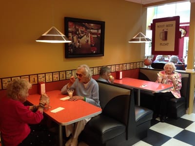 Residents enjoying ice cream in a dining area