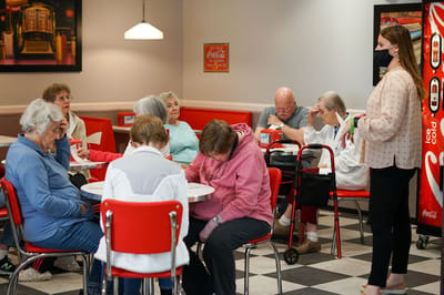 Residents participating in an activity in the dining room