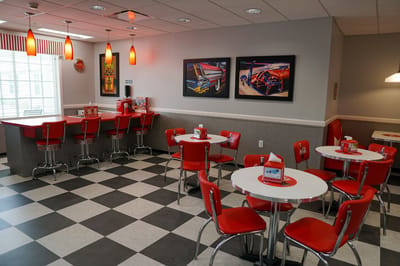 Bright dining area with retro-style decor and seating
